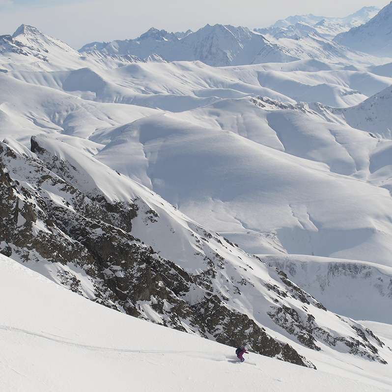 Skier skiing large mountains