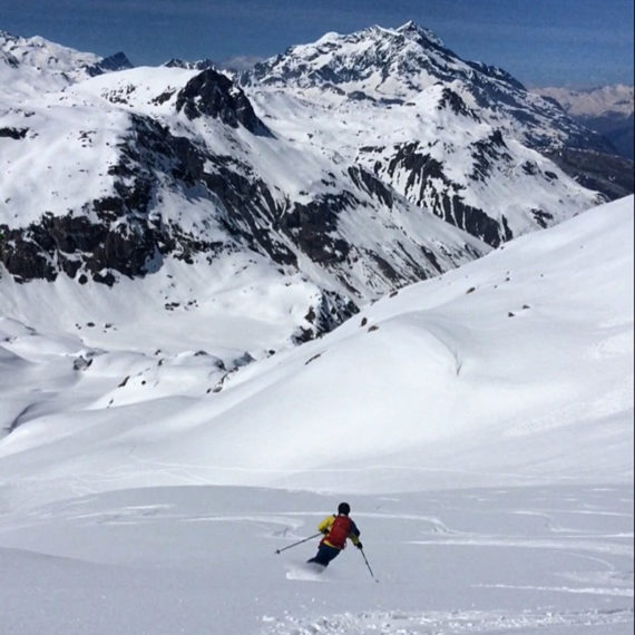 skier skiing down the mountain